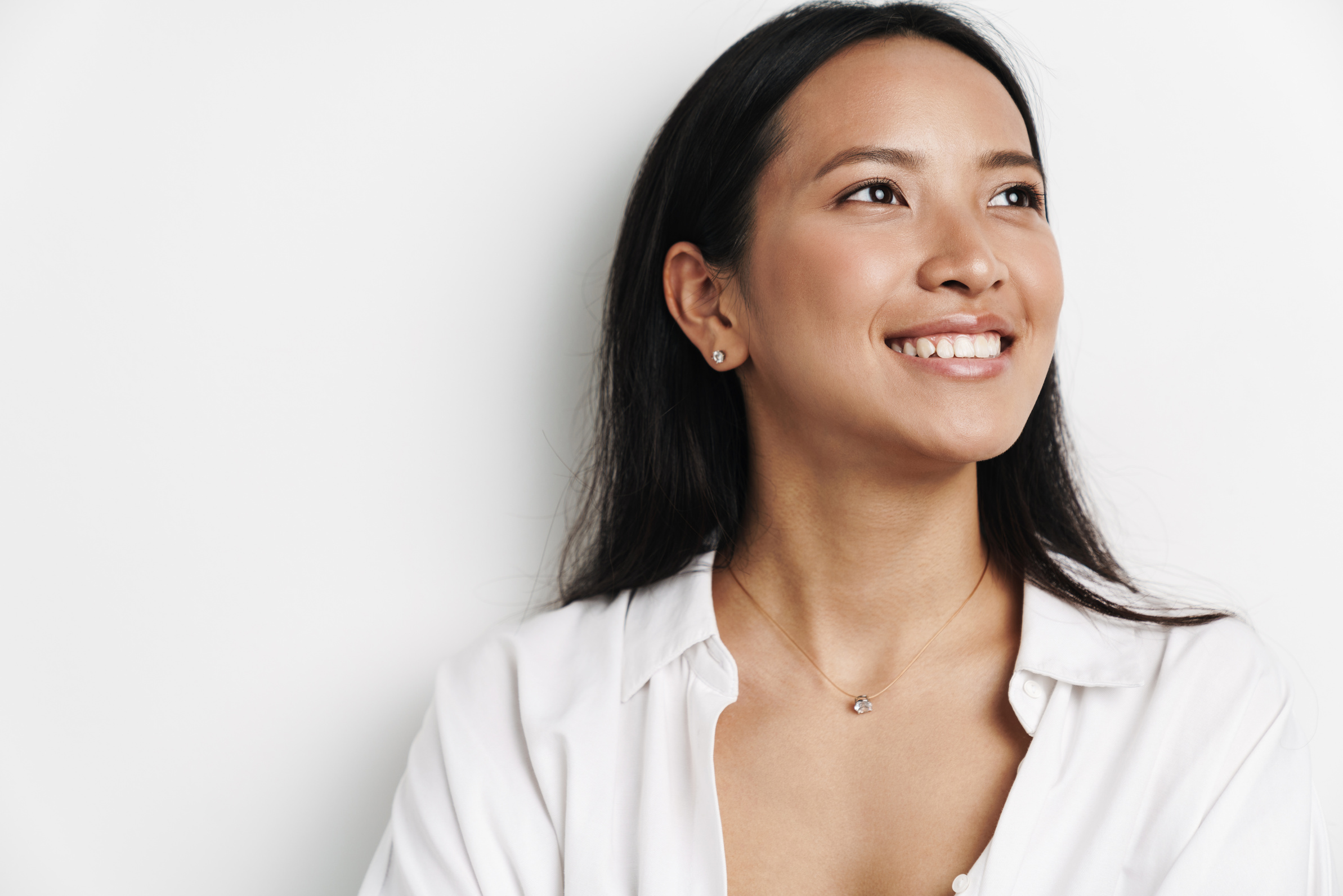 Beautiful Happy Asian Woman Smiling and Looking Aside